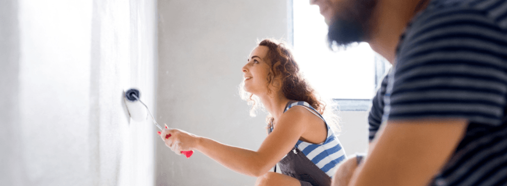 A woman redecorates her house after taking out a hoe improvement loan