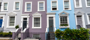 Answering mortgage questions with houses in the background