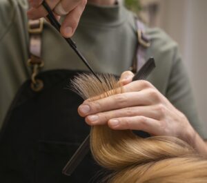 Income Protection for Self-Employed Hairdressers and Barbers hairdresser-taking-care-client-s-hair-indoors